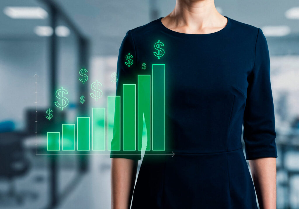 Gráfico crescente de dinheiro; ao fundo, profissional em ambiente de trabalho; Profissões PJ com os salários mais altos; veja quais são